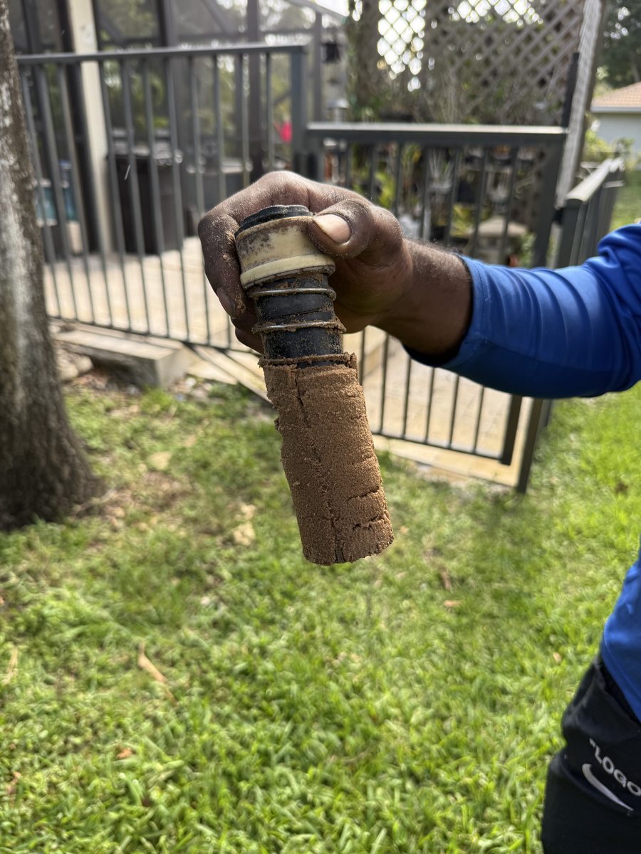 Sand-clogged sprinkler head from failed irrigation well — Coral Springs FL