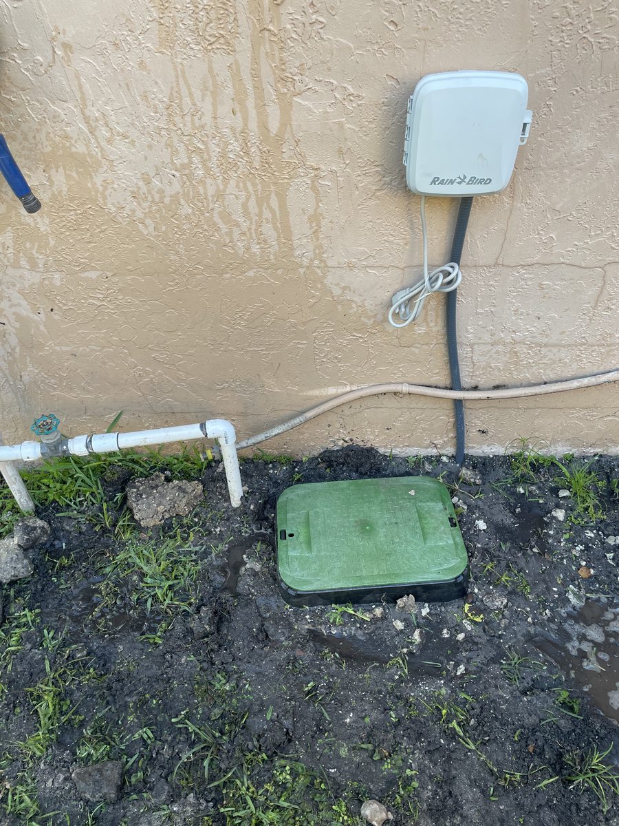 Before: outdated irrigation system with manual valves and basic Rain Bird controller in Coconut Creek, FL — no WiFi, no remote access